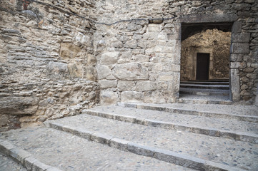 Fototapeta na wymiar Narrow and ancient street, historic center of Girona,Catalonia,Spain.