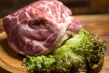 Fresh raw pork meat on wooden board