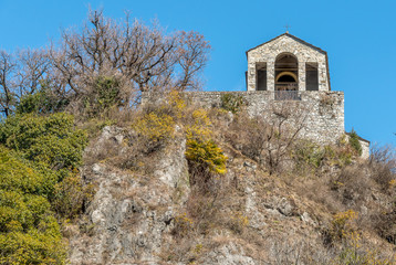 View of Small Stone Church of Saint Veronica on Rocca of Caldè, Castelveccana in the province of Varese, Lombardy, Italy