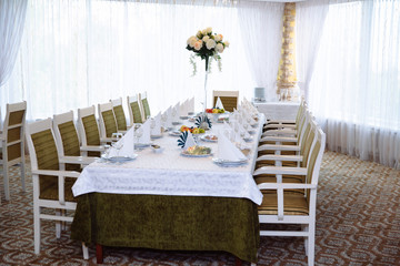 Beautiful decorated wedding restaurant for marriage. Colorful decoration for celebration. Beauty bridal interior. Concept of style of banquet hall
