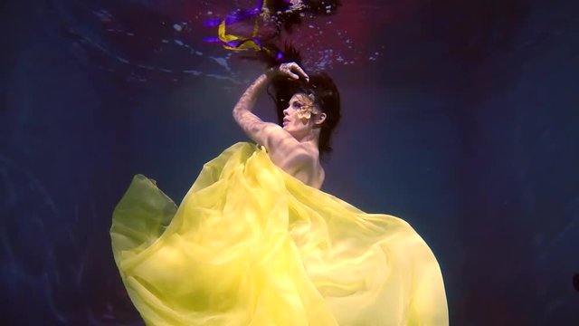 Attractive woman swims underwater