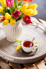 Colourful tulips and fresh tea