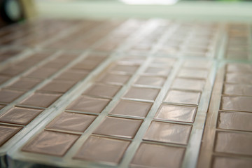 Chocolate poured into plastic mold, choco bars