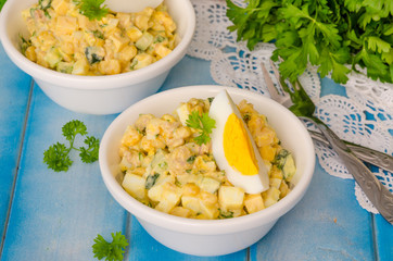 Salad with liver of cod, eggs, cucumbers and corn