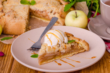 Open pie or galette with apples with cinnamon and crumbs