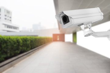 Security camera(cctv) with blurred background of walkway.