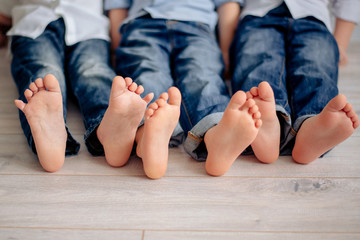 children's legs lie on the floor