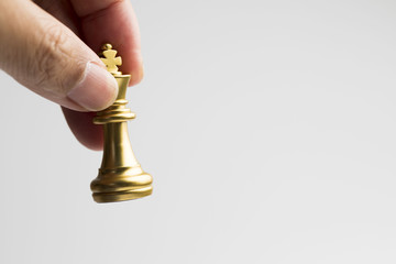 Hand holding gold king