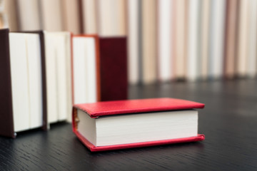 Stack books on wooden background. Back to school with copy space.