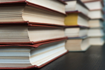 Stack books on wooden background. Back to school with copy space.