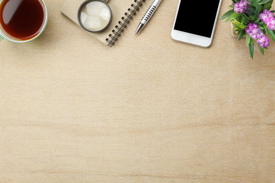 Table Top View Aerial Image Stationary On Office Desk Background Concept.Flat Lay Objects The Cup Of Black Coffee With Essential Accessory & Tree Plant.Items On Modern Brown Wooden At Home Studio.