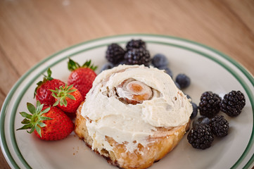 On the table are apetic baking and fresh berries