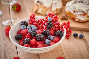 On the table are apetic baking and fresh berries