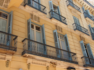 Old Building Facade with Closed Wooden Window Shutters