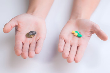 Pills in the hand. On a white background. Close-up.