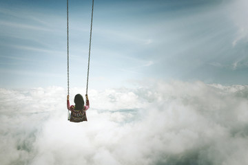 Lonely young woman with swing above cloud - obrazy, fototapety, plakaty