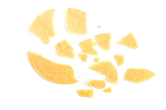 Potato chips crumbs and leftovers isolated over the white background
