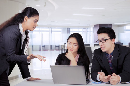 Indian Business Manager Talking To Her Team In A Meeting