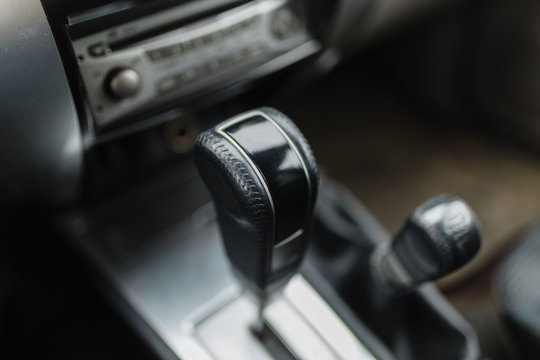 SUV automatic transmission close-up. Close up view of a gear lever shift manual gearbox car interior details.