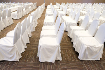 Fototapeta na wymiar Row of white chairs
