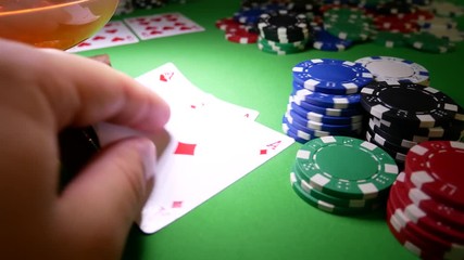 Hearts and diamonds aces card on green table in casino with poker chips. The gambler winner - Powered by Adobe