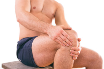 Man with knee pain over white background