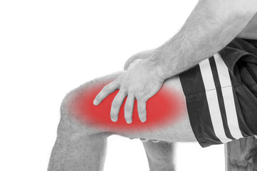 Man with quadriceps pain over white background