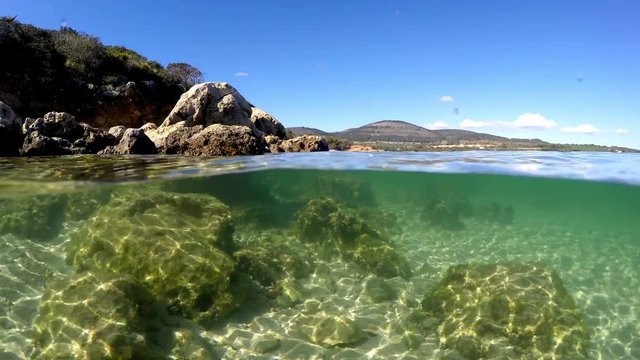 Split underwater view in Alghero turquoise sea. Sardinia, Italy