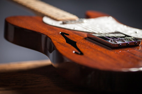 Close up of vintage electric guitar. Musical instrument for jazz , rock and blues styles. Black background