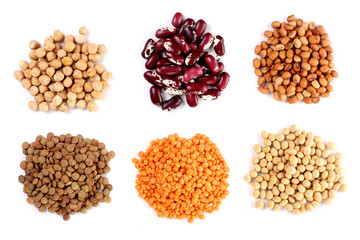 Collection set of Various dried kidney legumes beans, soybeans, lentils, chickpeas close up isolated on white background
