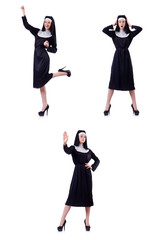 Young serious nun with sign stop isolated on white