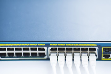 Corporate network concept. Set of ethernet switches, access points, cables, connectors, laptops on...