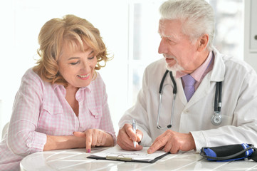 Senior doctor with elderly patient