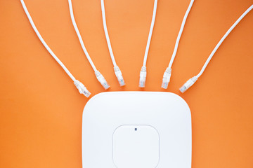 Corporate network concept. Set of ethernet switches, access points, cables, connectors, laptops on...