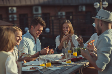 Young people at a party on the roof