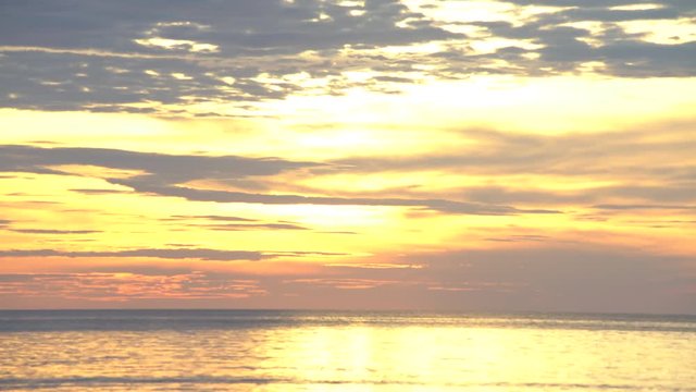 seascape with bright gold sunset colour sky background cinemagraph 4K loopable