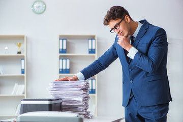 Businessman making copies in copying machine