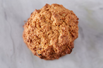 Sweet biscuits arranged in pattern on light textured background, close-up, shallow depth of field, selective focus.