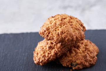 Sweet biscuits arranged in pattern on light textured background, close-up, shallow depth of field, selective focus.