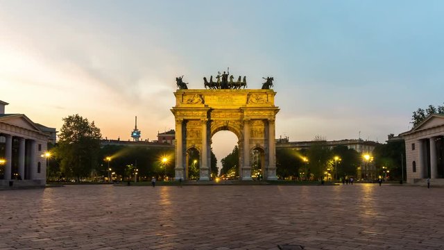 Time lapse of Arco della Pace "Arch of Peace" in Milan , Italy . It is the city gate of Milan located at the center of Simplon Square in Milan , Italy .