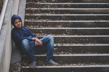 Portrait of asian man sad,drug addict man sitting on the floor,flakka drug,zombie drug