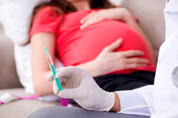 Pregnant woman patient visiting doctor for regular check-up