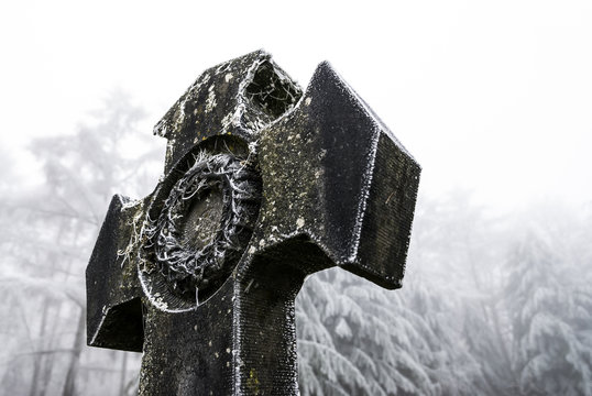 Graves with crosses at winter cemetery