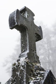 Graves with crosses at winter cemetery