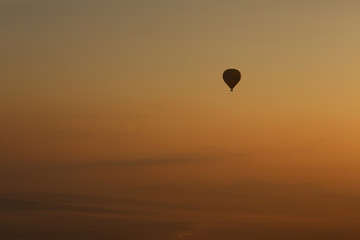 Hot air balloons, atmosphere ballons flying over mountain landscape at Mallorca in the sunrise