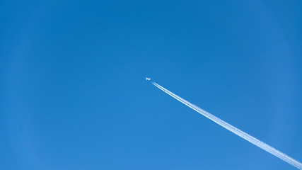 The flight of the aircraft in the blue sky day