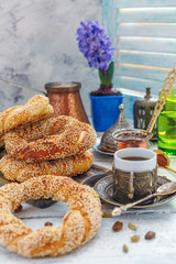 Turkish bagels with sesame seeds and coffee for breakfast.
