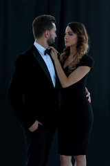 A young man and a woman looking each other