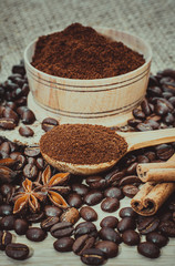 A cup of latte coffee and coffee beans. Toning.