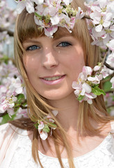 Naklejka premium young Woman and blooming spring